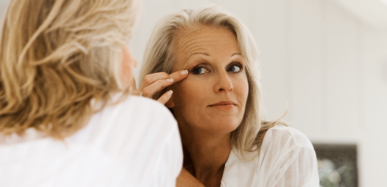 Woman looking in mirror