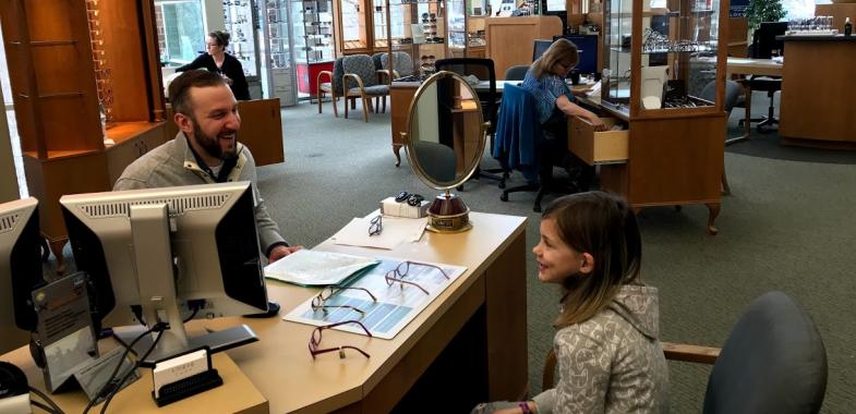 Child selecting glasses