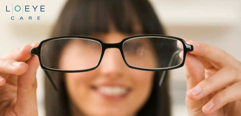 Woman looking through eye glasses