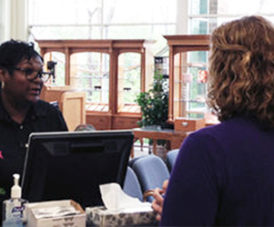 Woman with patient coordinator at first visit