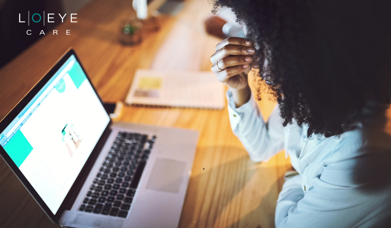 Woman staring at laptop