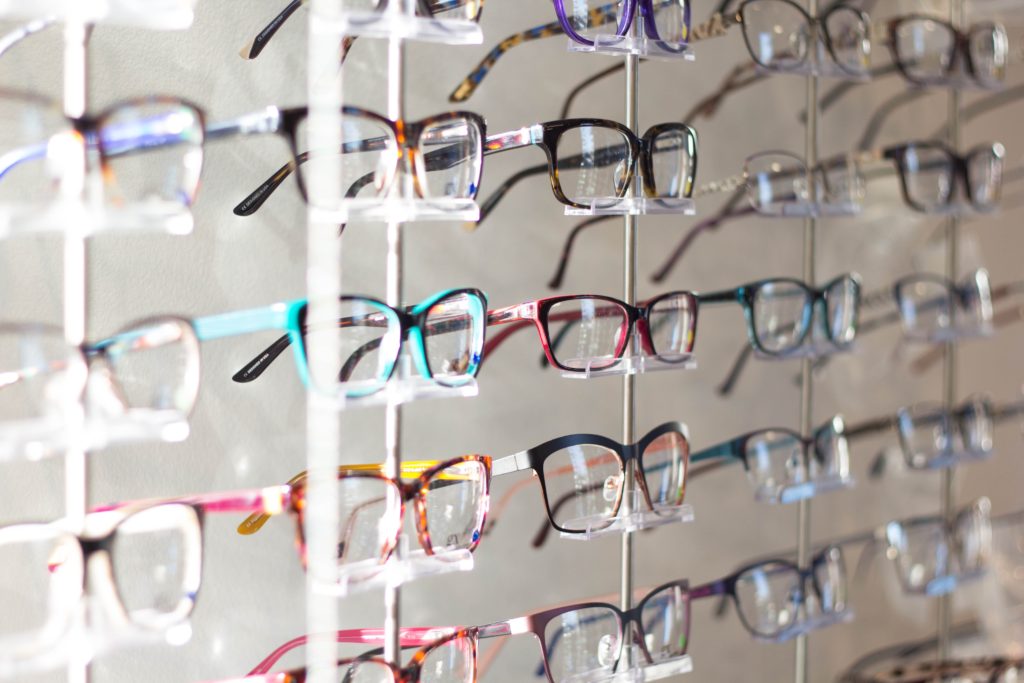 Wall of displayed eyeglasses